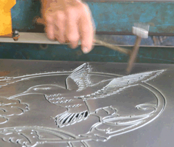 knocking out the chads at Custom Iron Works