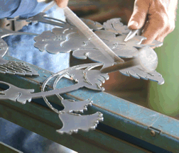 knocking off the slag at Custom Iron Works