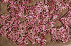 crochet flowers decorate a handbag