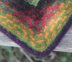 corner close up of felted churro rug