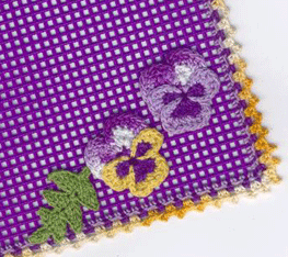 crocheted pansy embellishment on earring organizer