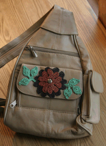 backpack with crocheted flowers